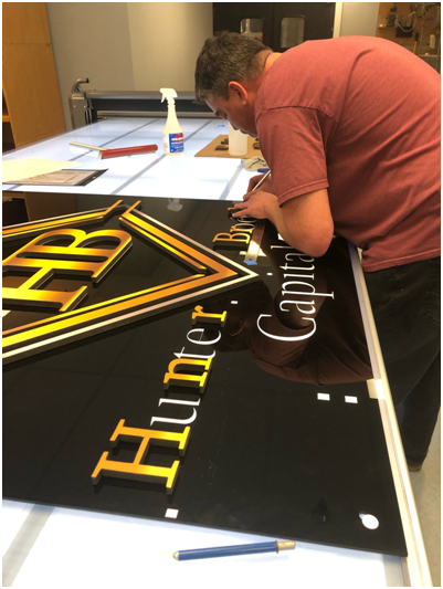 Baltimore Signs and Graphics’ indoor sign specialists hard at work...